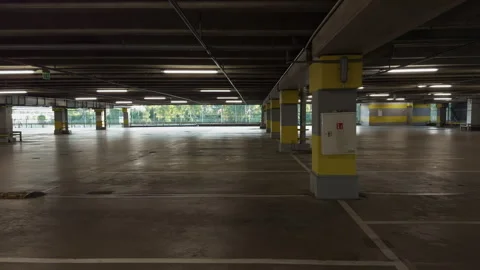 Empty multi level parking garage interior with wide concrete floor, ceiling Stock Footage 345124680