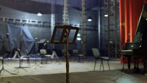An empty music area shrouded in subtle backstage shadows and silence Stock Footage 340661833