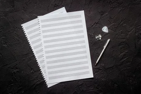 Empty music sheets for writing notes, top view. Compose music concept Stock Photos