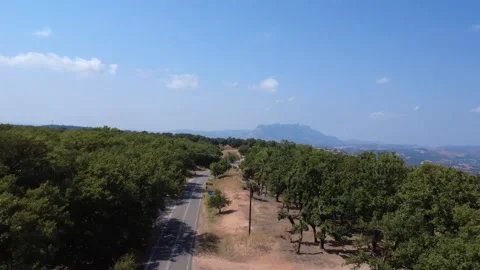 Empty National Road Through Dense Oak Forest And Mountain Landscape Stock Footage 326164844
