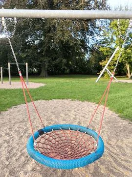 Empty nest swing in the park Stock Photos
