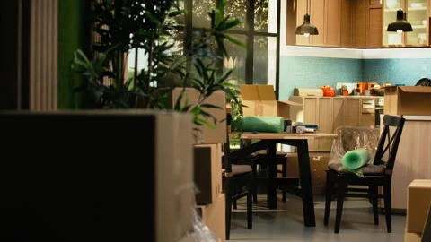 Empty new house interior with stacked cardboard boxes after relocation day Stock Footage 342903527