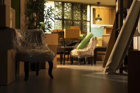 Empty new house interior with stacked cardboard boxes after relocation day Stock Photos