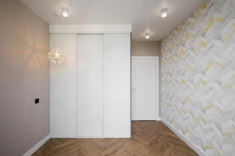 Empty new room with sliding wardrobe Stock Photos