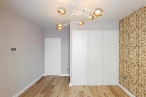 Empty new room with sliding wardrobe Stock Photos