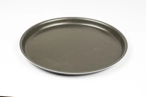 Empty new teflon pizza pan on the table Stock Photos