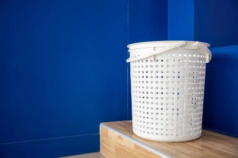 Empty new white plastic laundry clothes basket at convenience store for sup.. Stock Photos