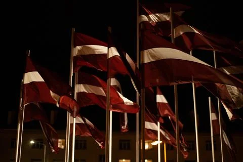 Empty night sky with glowing flag and bright beam of light. Stock Photos