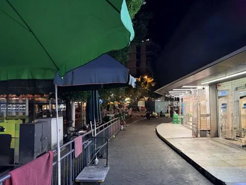Empty Night Street with Closed Shops and Outdoor Cafes Fotos de archivo
