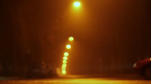 Empty night street in the defocus and fog. lanterns hang over the road, cars Video stock 83610919