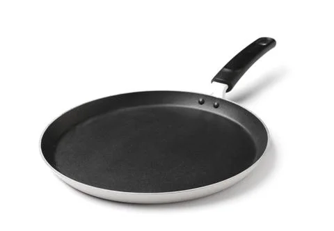 Empty non-stick crepe pan with black handle for cooking pancakes and flatbrea Stock Photos