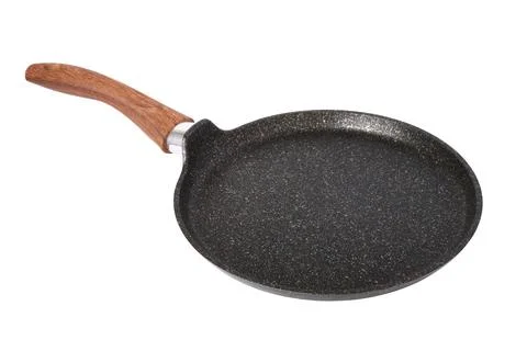 Empty nonstick pan with handle for baking pancakes, isolated on white, shallo Stock Photos