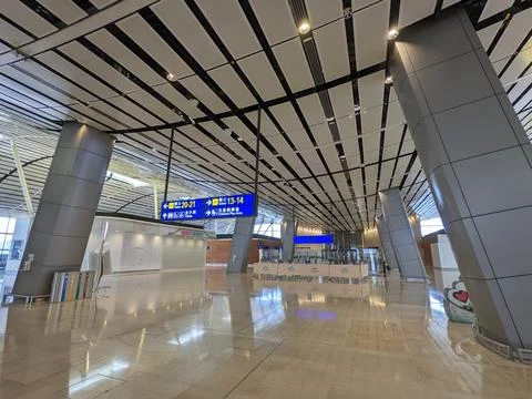 The empty North Satellite Concourse with closed shops, escalators, and rubbish Stock Photos