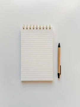 Empty note pad for making lists, notes and journaling with a pen on white tab Stock-Fotos