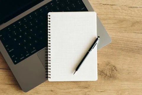 Empty notebook and laptop on table flatlay workspace, copy space. 스톡 사진