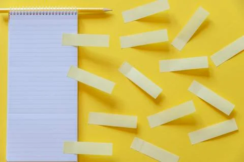 Empty notebook and yellow stickers Stock Photos