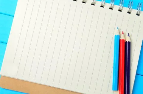 Empty notebook with colorful pencils Stock Photos