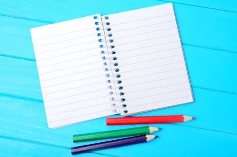 Empty notebook with colorful pencils Stock Photos