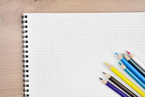 Empty notebook with colorful pencils Stock Photos