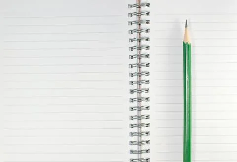 The empty notebook with green pencil, ready to note or work Stock Photos