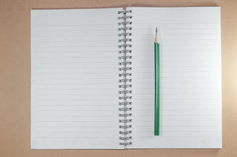 The empty notebook with green pencil, ready to note or work Stock Photos