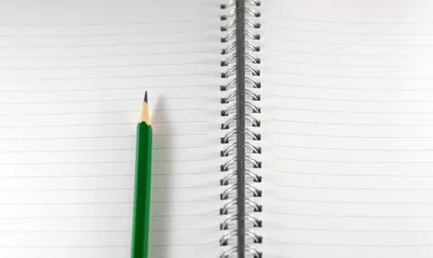 The empty notebook with green pencil, ready to note or work Stock Photos