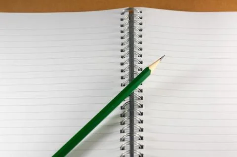 The empty notebook with green pencil, ready to note or work Stock Photos