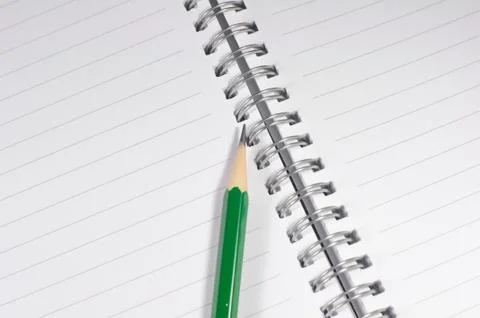 The empty notebook with green pencil, ready to note or work Stock Photos