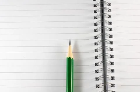 The empty notebook with green pencil, ready to note or work Stock Photos