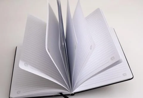 Empty notebook laying opened on the table Stock Photos