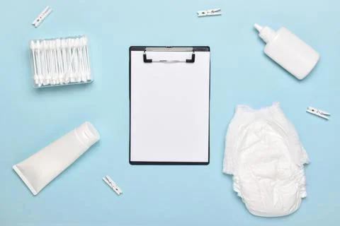 An empty notebook on a light blue background with children's body care access Stock Photos