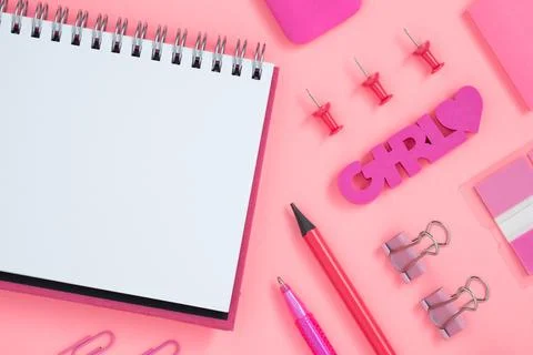 Empty notebook page for text with pink stationery. Eraser in form of word gir Foto stock