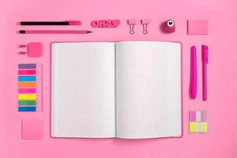 Empty notebook page for your text with pink stationery on pink backdrop Stock Photos