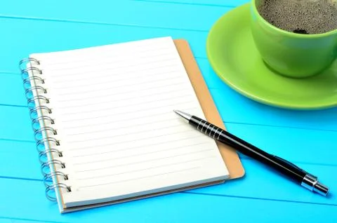 Empty notebook with pen and coffee cup Stock Photos