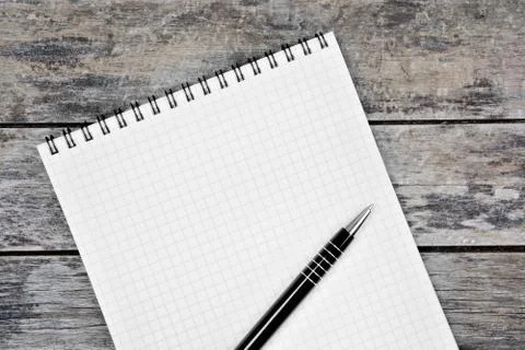 Empty notebook with pen on desk Stock Photos
