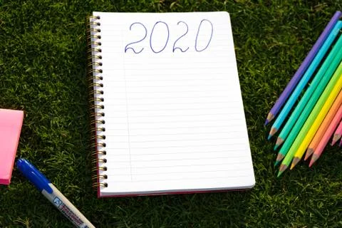 Empty notebook ready for New 2020 Year planing or wish list in the grass with Foto stock