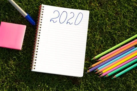 Empty notebook ready for New 2020 Year planing or wish list in the grass with Foto stock