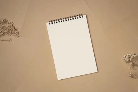 Empty notebook on sheets of paper background from above. Copy space Stock Photos