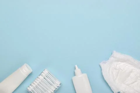 An empty notebook on a soft blue background with children's body care accesso Foto stock