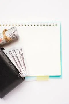 Empty notebook with wallets on white background Stock Photos