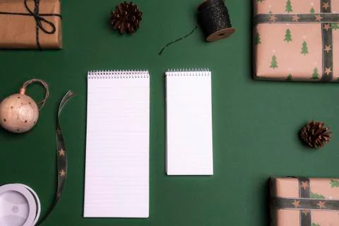 Empty notebooks surrounded by gifts Stock Photos