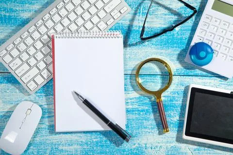 Empty notepad calculator and other business objects. Stock Photos