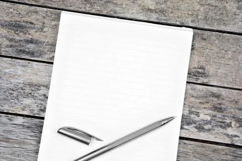 Empty notepad with pen on table Stock Photos