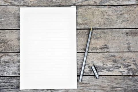 Empty notepad with pen on table Stock Photos
