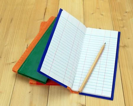 Empty notepad on wooden surface and pencil Stock Photos