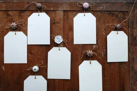 Empty notes on rustic wood hanging on a variety of knobs Stock Photos