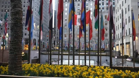 Empty NYC Rockefeller Center Flags Moving Profile Perspective Stock Footage 127930356