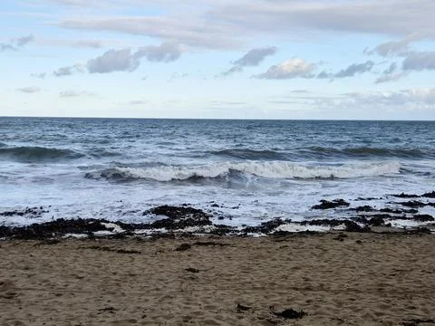 Empty Ocean Beach With Stormy Waves Background 写真素材