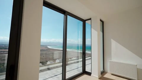 Empty oceanfront penthouse tour showcasing spacious rooms, panoramic views, high Stock Footage 270326942