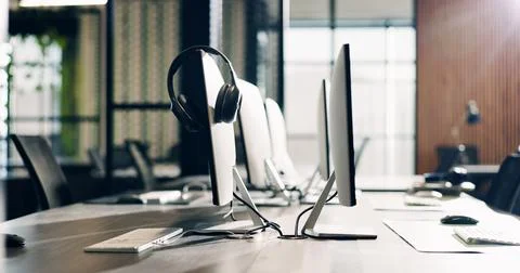 Empty, office and headset on computer on desk for lead generation, customer Stock Photos